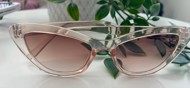 Cateye solbriller i gennemsigtige beige stel med brune glas